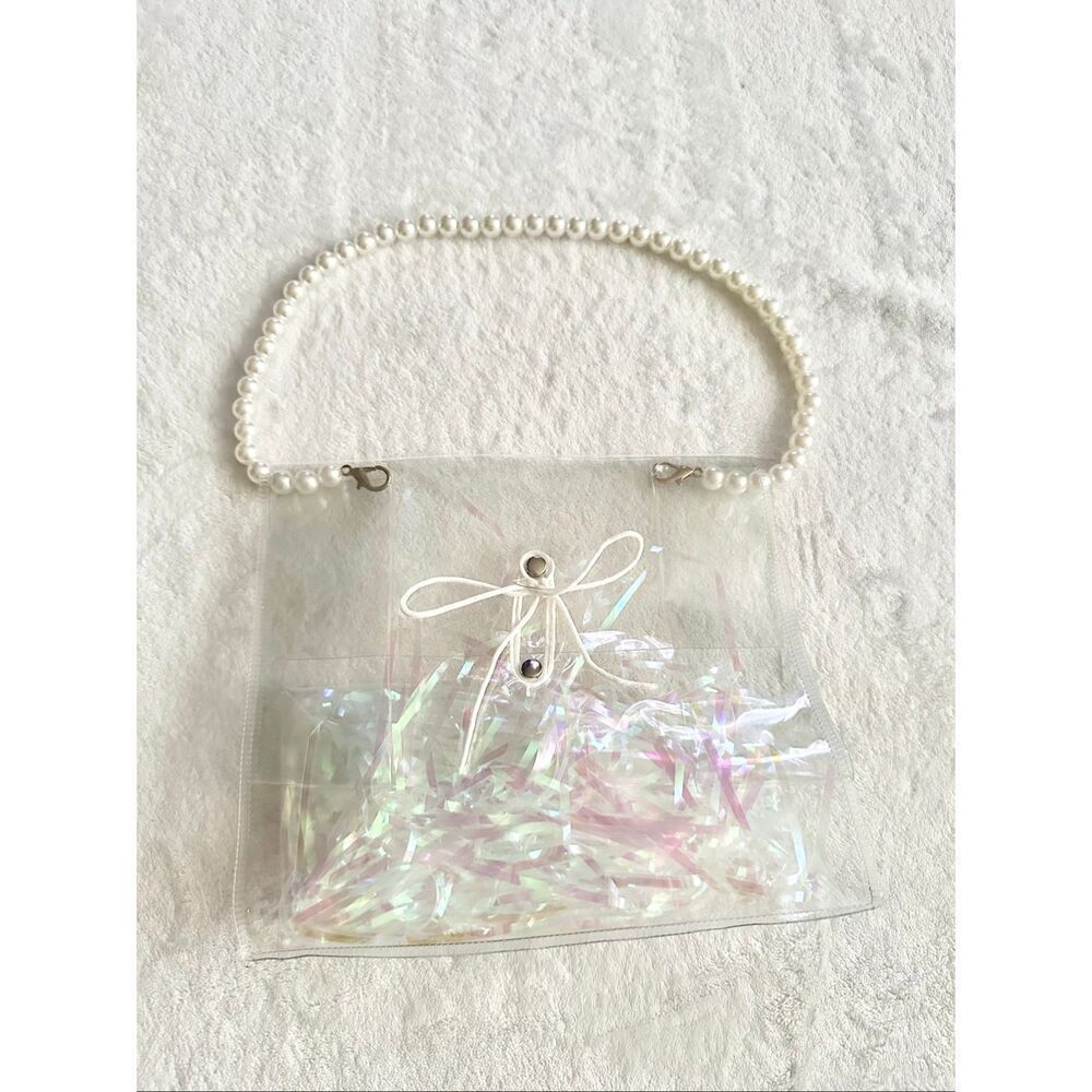 Clear pearl strap handbag with tie close